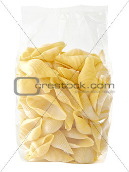 raw uncooked italian conchiglie jumbo shell pasta in plastic bag