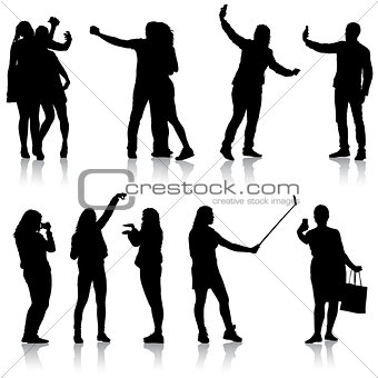 Set silhouettes man and woman taking selfie with smartphone on white background. Vector illustration
