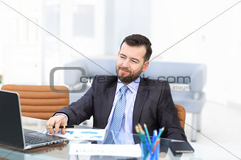 Business man using laptop and modern devices in office