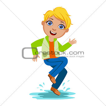 Boy Dancing Splashing Water, Kid In Autumn Clothes In Fall Season Enjoyingn Rain And Rainy Weather, Splashes And Puddles