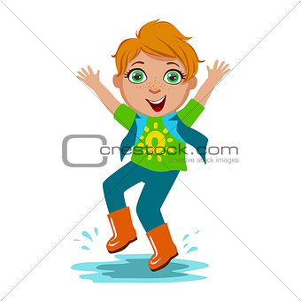 Boy In T-Shirt And Rubber Boots, Kid In Autumn Clothes In Fall Season Enjoyingn Rain And Rainy Weather, Splashes And Puddles