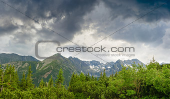 Mountains on the background of the sky with storm clouds