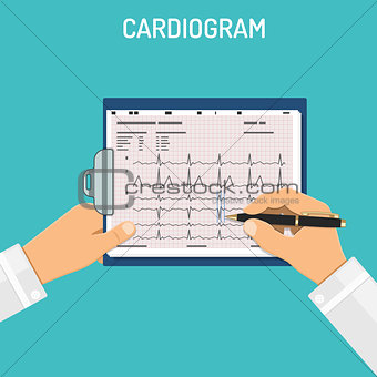 Cardiogram on clipboard in hands of doctor