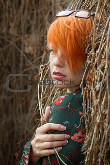 Beautiful girl with short red hair.