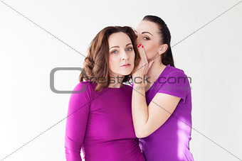 girl friend whispers in his ear the secret