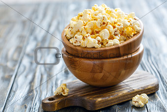 Wooden bowls with salted popcorn.