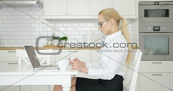 Confident woman working at home