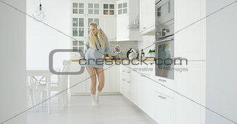 Dancing woman in kitchen