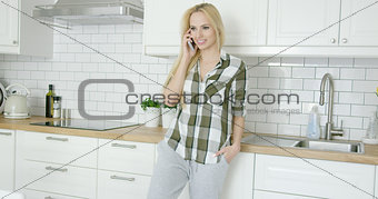 Girl talking by phone at home