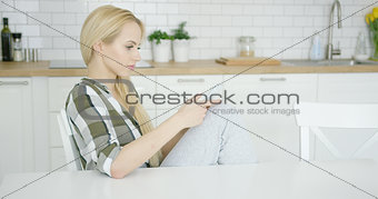 Woman using phone at home