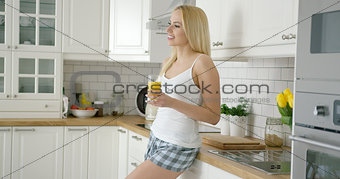 Smiling woman with glass of juice