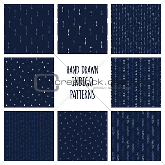 Set of hand drawn indigo blue patterns. Seamless vector native american backgrounds with triangles and arrows.
