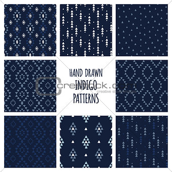 Set of hand drawn indigo blue patterns. Seamless vector aztec backgrounds with triangles, arrows, rhombuses and diamonds.