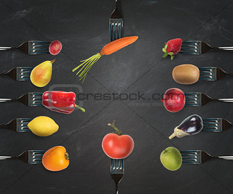 Background of forks with various vegetables and fruits