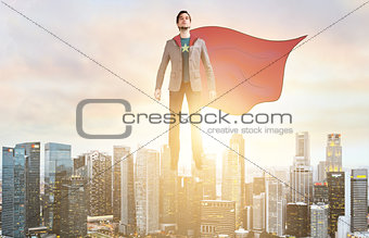 Business super hero hover over city skyline