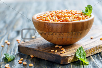 Yellow split peas in a wooden bowl.