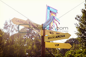 Close Up Of Signpost At Outdoor Music Festival