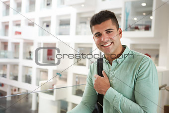 Young adult Middle Eastern male student smiling to camera