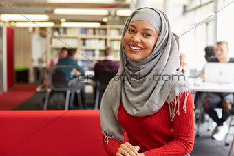 Portrait Of Female University Student Working In Library