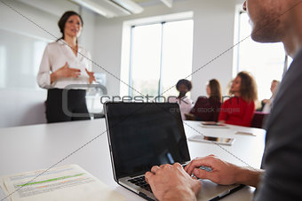 Close Up Of Student Using Laptop In Lecture