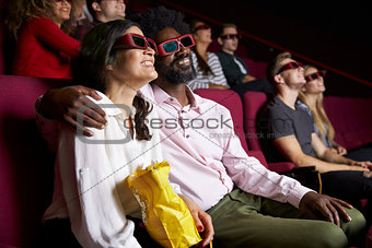 Couple In Cinema Wearing 3D Glasses Watching Comedy Film