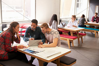 Group Of University Students Working In Study Room