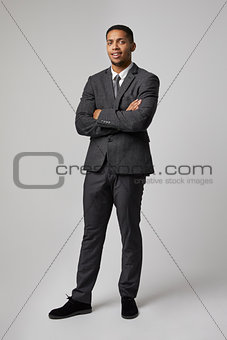 Studio Portrait Of Businessman Wearing Suit