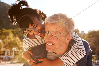 Mixed race couple lying on the beach holding hands, Ibiza