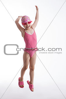 Little girl in a pink swimsuit