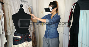 Female in VR headset working in parlour