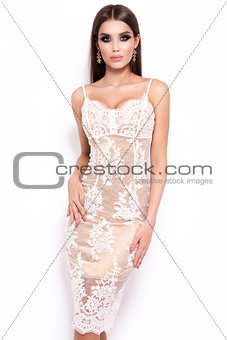 Fashion photo of young magnificent woman in luxury dress.