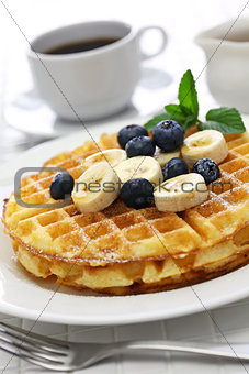 homemade american round waffles with blueberry and banana