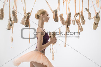 Blonde ballerina with pointe shoes