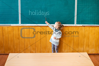 Child points to a school board