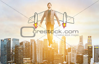 Business man hover over city skyline