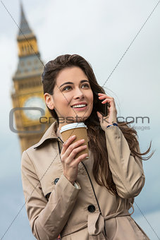 Woman Drinking Coffee Using Cell Phone, Big Ben, London, England