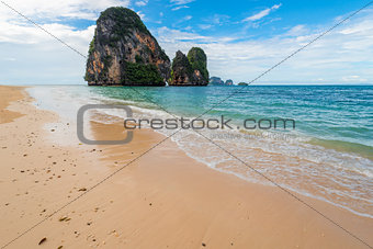 Waves on the shores of the Andaman Sea and a view of the rock