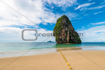 Lonely rock in a picturesque tropical place in Thailand, sea vie