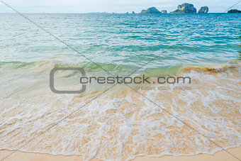 Waves of the Andaman Sea close-up, sandy beach