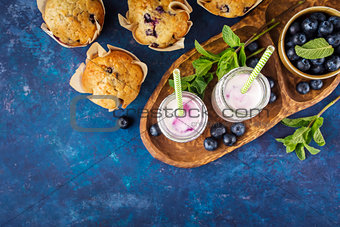Homemade muffins with blueberries and yogurt with mint.