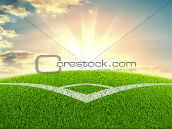 Football field on the background of sunrise