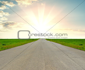 Asphalt road against beautiful sunrise