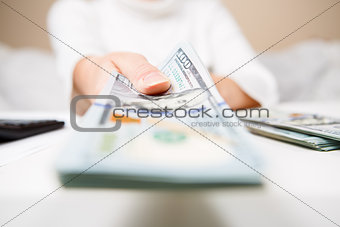 Hands of person proposing money to you - closeup shot