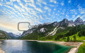 Alpine summer lake sunset panorama.