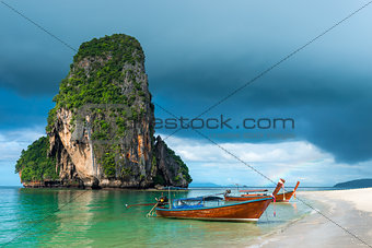 Small traditional Thai boats off the coast of Phra Nang, Thailan