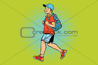 Boy student with a backpack goes to school or Hiking