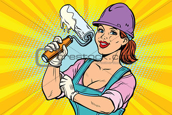 Construction worker with roller for paint. Woman professional
