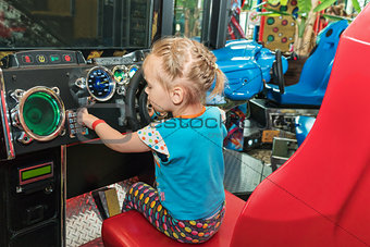 Little girl on the game simulator
