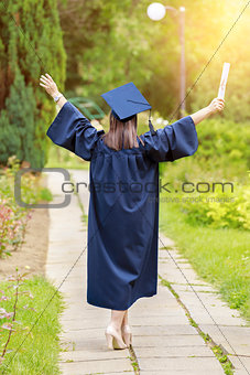 Young woman in graduation day celebrating