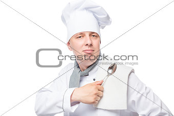 successful chef with a towel and a spoon on a white background